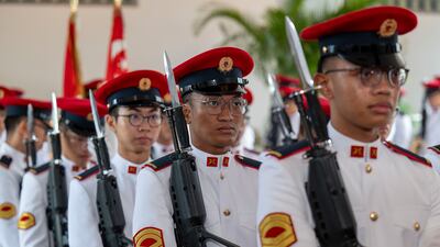 A guard of honour lined up to welcome Sheikh Khaled to Singapore