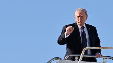 US President Donald Trump boards Air Force One at Palm Beach International Airport. Getty Images / AFP