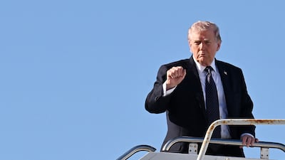 US President Donald Trump boards Air Force One at Palm Beach International Airport. Getty Images / AFP