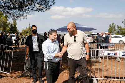 Far-right Finance Minister and leader of the Religious Zionist Party, Bezalel Smotrich, centre, arrives for a party meeting organised on a hill overlooking the northern Arab-Israeli town of Majd Al Kurum on September 24. AFP