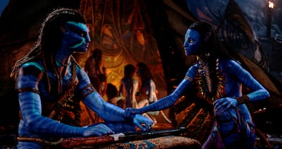 Jake Sully, played by Sam Worthington, left, and Neytiri, played by Zoe Saldana in a scene from Avatar: The Way of Water. Photo: 20th Century Studios