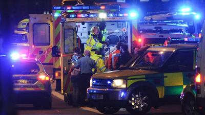 Members of the emergency services attend to victims of the terror attack on London Bridge AFP