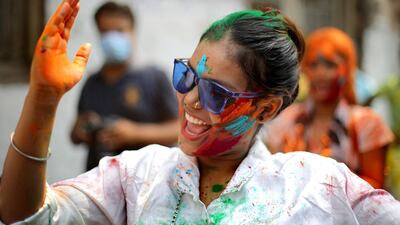Tourists and locals apply colour dust to each other as they celebrate Holi festival in Kolkata, Eastern India. EPA