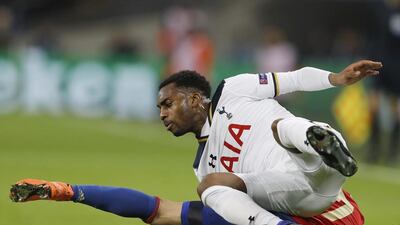 Tottenham's Danny Rose and CSKA's Zoran Tosic fall while fighting for possession. Frank Augstein / AP