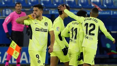 Atletico Madrid's Luis Suarez celebrates after scoring a last-gasp winner in their 2-1 La Liga victory against Alaves at the Mendizorroza Stadium on January 3. AFP