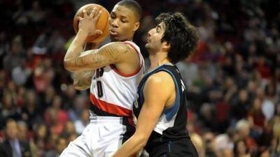 Portland Trail Blazers guard Damian Lillard, left, has emerged as the leading candidate for this season's Rookie of the Year. Steve Dykes / EPA