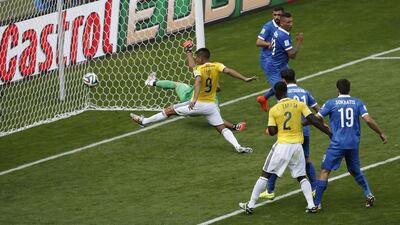 Colombia forward Teofilo Gutierrez, centre, scores during a Group C match against Greece on Saturday in Belo Horizonte, Brazil. Adrian Dennis / AFP