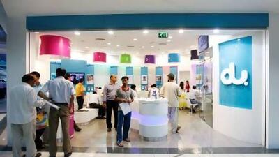 Customers line up at the du service centre in Khaleej Centre in Bur Dubai. Sarah Dea / The National