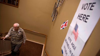 A retiree walks up stairs after voting at the Greenspring Retirement centre during the mid-term election day in Fairfax, Virginia. AFP