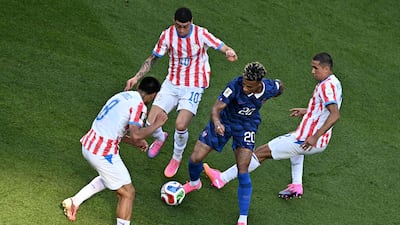 France forward Desire Doue is engulfed by Paraguay defenders in the penalty box in Philadelphia. France won 1-0 thanks to a penalty from Kylian Mbappe. AFP