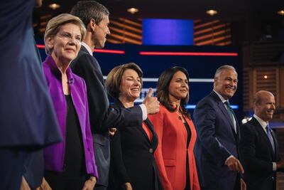 Democratic presidential hopefuls: from left, Elizabeth Warren, Beto O'Rourke, Amy Klobuchar, Tulsi Gabbard, Jay Inslee and John Delaney during the debate in Miami. Bloomberg