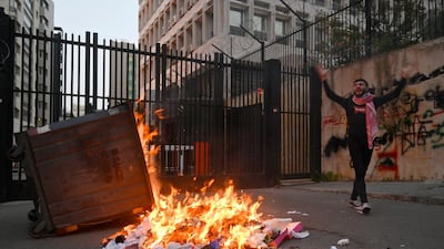 An anti-government protester shout slogans during a demonstration in Beirut. The national currency has lost more than 85 per cent of its market value against the dollar. EPA