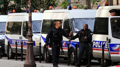 Police officers control an area outside the Paris police headquarters, Thursday, Oct.3, 2019 in Paris. An administrator armed with a knife attacked officers inside Paris police headquarters Thursday, killing four before he was fatally shot. AP Photo/Michel Euler