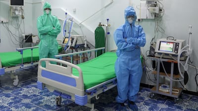 Health workers, wearing their personal protective equipment (PPE), are seen at the newly-inaugurated intensive care unit for COVID-19 patients in Yemen's third city of Taiz, on April 30, 2020. Yemen's healthcare system has been blighted by years of war that have driven millions from their homes and plunged the country into what the United Nations describes as the world's worst humanitarian crisis. / AFP / AHMAD AL-BASHA