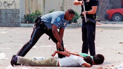 Following the officers' acquittal in 1992, rioting broke out across Los Angeles. AP