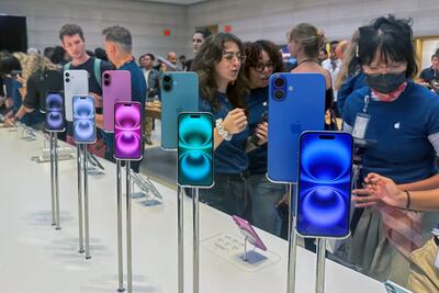 People explore the iPhone 16 line-up at an Apple Store in New York. AP
