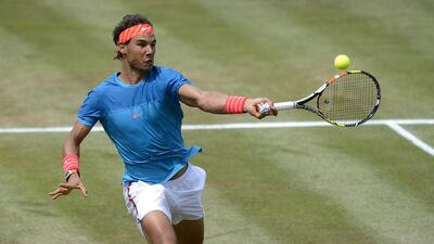 Rafael Nadal of Spain returns during his match against Gael Monfils. Daniel Kopatsch / Bongarts