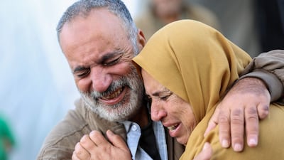 Anger and grief as victims of Israeli bombardment are taken to a hospital at Deir Al Balah in the central Gaza Strip on December 20, 2023. AFP