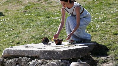 Greek actress Xanthi Georgiou, playing the role of High Priestess lights the flame during the Olympic flame lighting ceremony for the Tokyo 2020 Summer Olympics in Ancient Olympia, Greece. Reuters