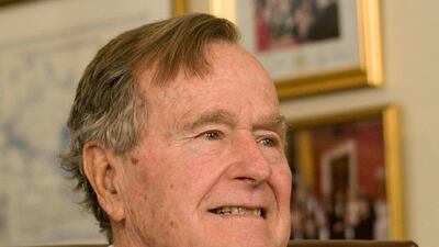 Former President George H.W. Bush smiles as he listens to Republican presidential candidate Mitt Romney speak as he met with Bush to pick up his formal endorsement in Houston, Texas, U.S. Donna Carson / Reuters / March 29, 2012