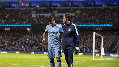 Manchester City's Sergio Aguero walks off injured during his side's Premier League win against Everton on Saturday. Jon Super / AP / December 6, 2014