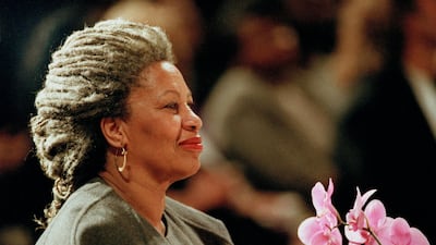 FILE - In this April 5, 1994 file photo, Toni Morrison as she holds an orchid at the Cathedral of St. John the Divine in New York. On being awarded the 1993 Nobel Prize in Literature, Morrison's work was praised for its "visionary force and poetic import" and for giving "life to an essential aspect of American reality." Her novels, such as "Beloved," have shone a light on the racial prejudices that have afflicted her homeland. This year's winner is set to be announced on Thursday, Oct. 5, 2017. (AP Photo/Kathy Willens, File)