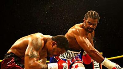 David Haye, right, of Great Britain, proved too strong for the American Monte Barrett during their heavyweight fight.
