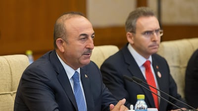 Turkish foreign minister Mevlut Cavusoglu, pictured here in Beijing on August 3, 2017, has warned that the Kurdish independence referendum could bring Iraq to civil war. Roman Pilpey - Pool / Getty Images