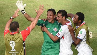 Costa Rica's Bryan Ruiz, second right, and Keylor Navas, second left, celebrate with teammates following their 1-0 win over Italy on Friday at the 2014 World Cup in Recife, Brazil. Javier Soriano / AFP / June 20, 2014