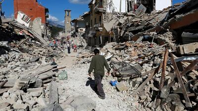 A man walks amid rubble following an earthquake in Pescara del Tronto, central Italy, on August 24, 2016.Remo Casilli/Reuters