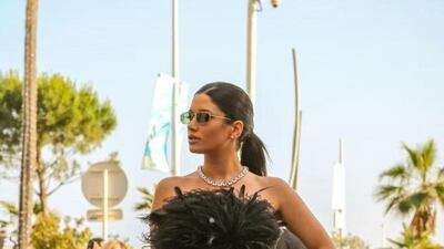 Cynthia Khalifeh in a lace-fitted dress in chic black, topped with feathers, from the ready-to-wear autumn-winter 2022 collection. Photo: Rami Al Ali