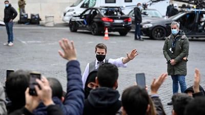 Tom Cruise greets fans during the shooting of 'Mission: Impossible 7' at Piazza Venezia in Rome, Italy on November 29, 2020. EPA