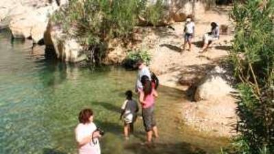 Some expatriates reveal a bit too much as they cool off in a wadi near Nizwa.