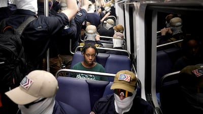 White nationalists on the Washington subway surround a passenger on July 4, 2026. Reuters