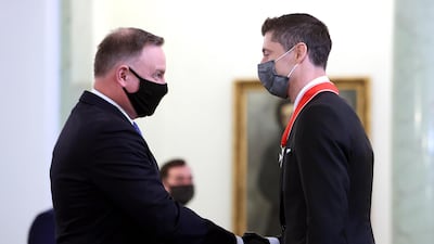 Bayern Munich's Polish striker Robert Lewandowski receives the Commander's Cross of the Order of Polonia Restituta. EPA