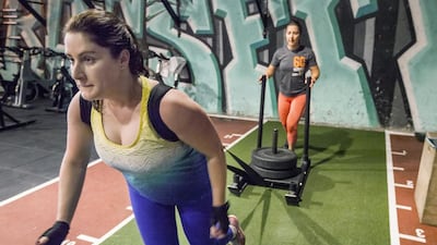 Ana Sousa-Matos goes through her strength training workout with trainer Malin Blomdahl-Lenner at the Warehouse Gym in Al Quoz. Antonie Robertson / The National