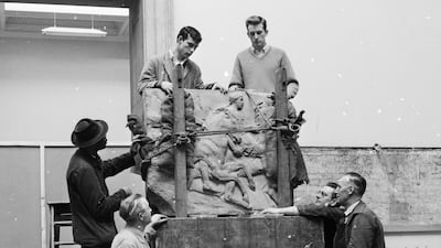 Workmen unload a portion of the Parthenon frieze before affixing it to the wall in the new Elgin Marbles room in 1961