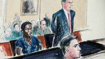 In this June 9, 2009 file courtroom sketch, Guantanamo detainee Ahmed Khalfan Ghailani, left, listens as his civilian lawyer Scott Fenstermaker, right, speaks.
