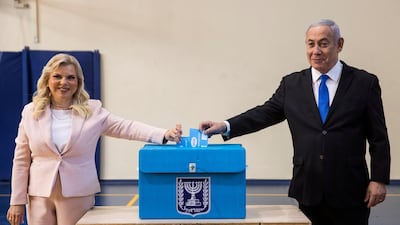 Israeli Prime Minister Benjamin Netanyahu and his wife Sara casts their votes during Israel's parliamentary election. Reuters