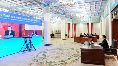 Chinese Vice Premier Han Zheng, right, meets US climate envoy John Kerry via video link in Beijing. AP