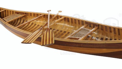 Joey Tribbiani and Chandler Bing's Wood Canoe and Two Paddles. Courtesy Prop Store. Courtesy Prop Store