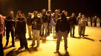 Palestinians wait on Monday to board a the new Israeli bus line that is for Palestinians only. Uriel Sinai / Getty Images