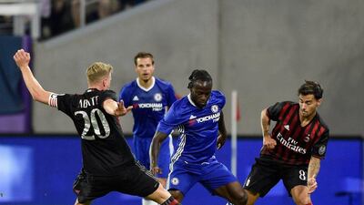 Chelsea winger Victor Moses controls the ball against Ignazio Abate and Fernandez Jesus of AC Milan. Hannah Foslien / Getty Images