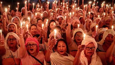 Women during a candlelight vigil in the Indian city of Imphal to honour those who lost their lives in ethnic clashes in Manipur state. AFP