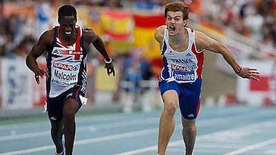 France's Christophe Lemaitre, right, crosses the finish line a fraction ahead of Britain's Christian Malcolm in the 200 metres last night.