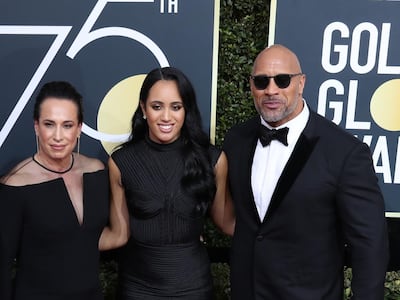 Johnson at the 2018 Golden Globes with his ex-wife and business partner Dany Garcia and daughter Simone Johnson. EPA