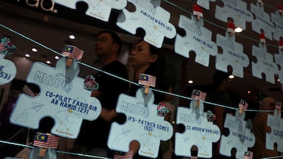 Names of crew members and passengers of the missing Malaysia Airlines flight MH370 are displayed during a remembrance event marking the 10th anniversary of the plane's disappearance, in Subang Jaya, Malaysia. Reuters