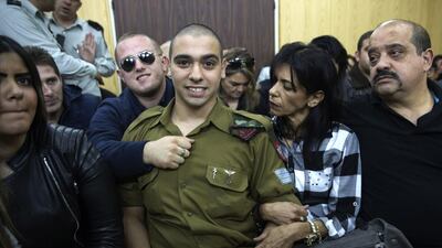 Israeli solider Elor Azaria waits with his parents for the verdict inside the military court in Tel Aviv. He was found guilty of manslaughter for shooting wounded Palestinian Fatah Al Sharif as he lay on the ground. Heidi Levine / AP Photo