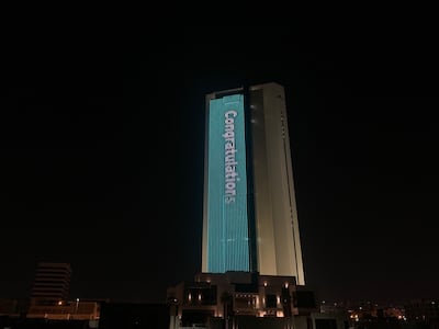 In Abu Dhabi, a Mubadala building was lit up to mark the successful debut on the Nasdaq of GlobalFoundries shares. Cody Combs / The National