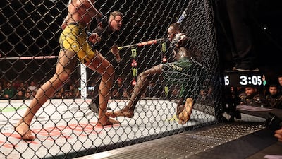 Alex Pereira knocks down Israel Adesanya during the fifth round on his way to victory. AFP